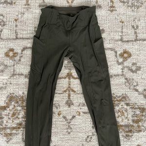 Olive green Lululemon athletica Leggings. Side and back zip pockets. Size 6